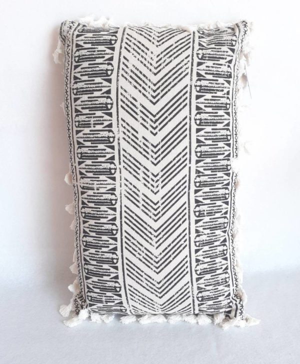 Coussin ethnique avec motifs géométriques